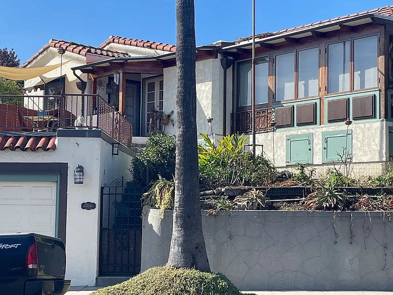 East Side of House with Entry Gate & Stairs up to Terrace & to Guest Patio & Entry to Guest Suite
