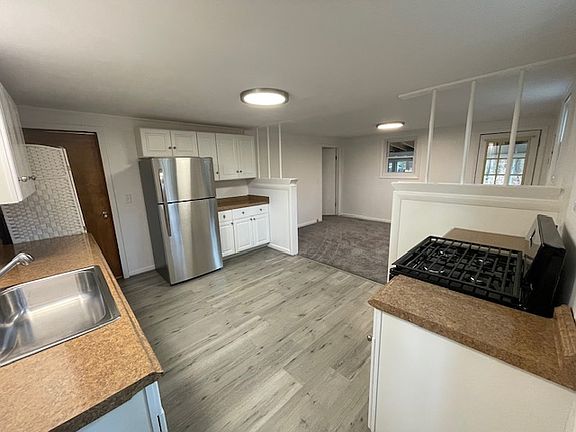 Brand new appliances, flooring, paint, lighting. Kitchen is approx. 14' x 11'