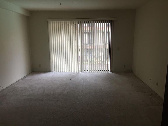 upstairs bedroom with deck overlooking pool