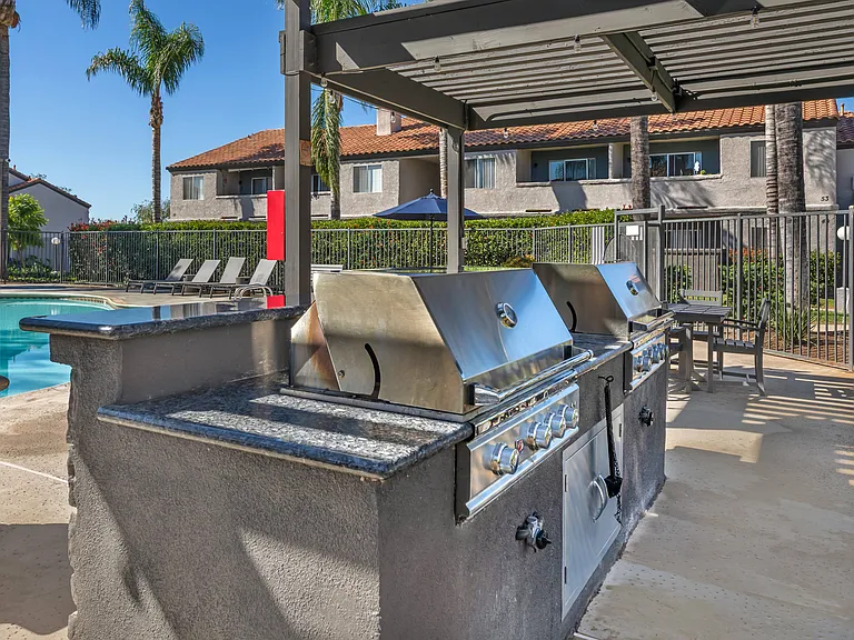 Sedona Apartments in Moreno Valley features a renovated pool deck with a gazebo and gas grillsperfect for relaxing and entertaining outdoors.