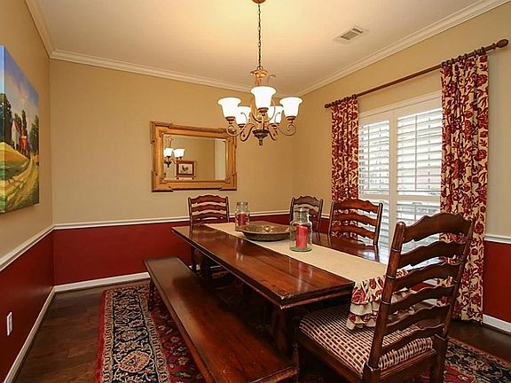 Elegant formal dining room to the right of the entry hall