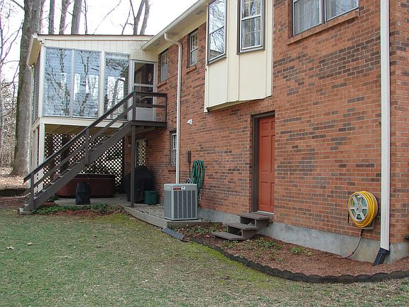 Back view showing porch and patio