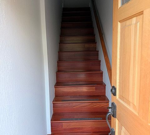 Stairway up to the second floor, where the living space is located. Brazillian Cherry sold 3/4" hardwood floors (BR111 luxury hardwood floors).