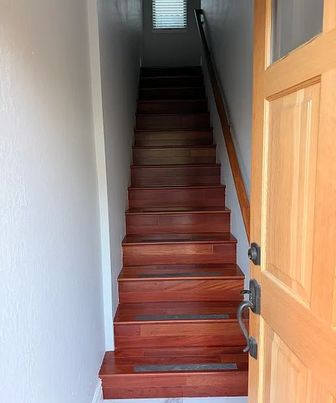 Stairway up to the second floor, where the living space is located. Brazillian Cherry sold 3/4" hardwood floors (BR111 luxury hardwood floors).
