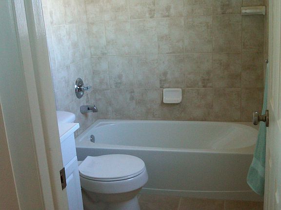 Floor to Ceiling Designer TIle in all  3 Baths