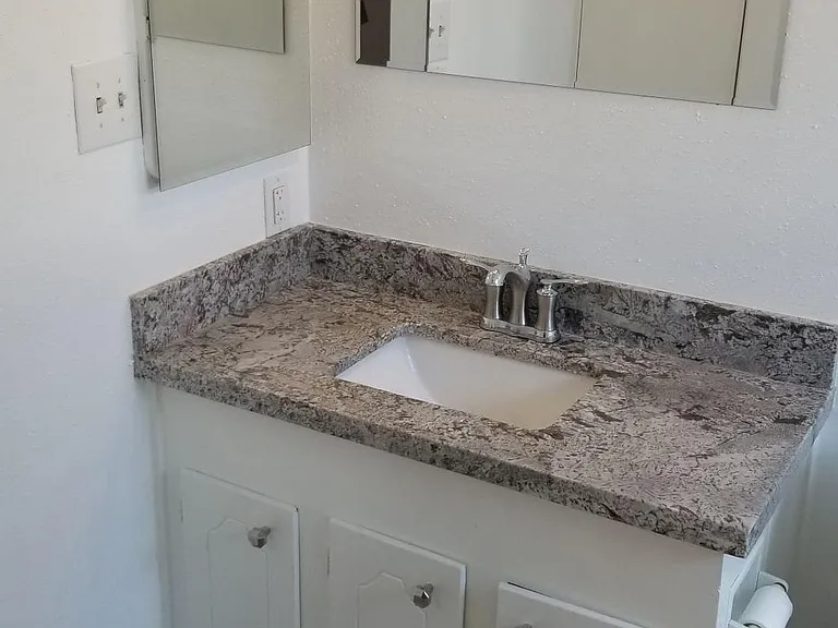 Master Bath. Tile Flooring, Granite Vanity with built - ins.