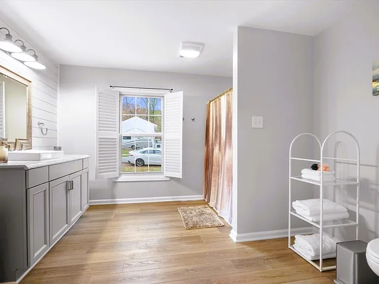 Spacious full bathroom in the master suite, with handrails.