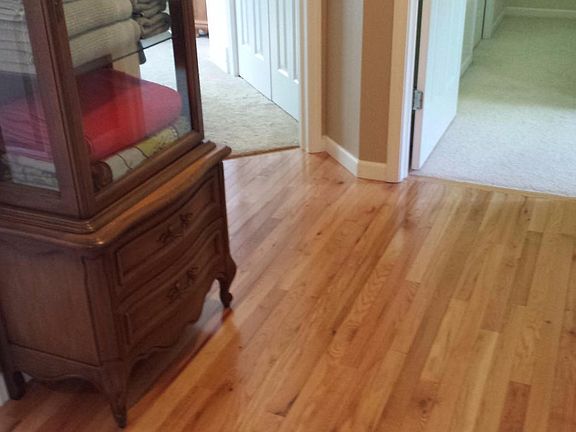 Glowing hardwood floor upper hallway
