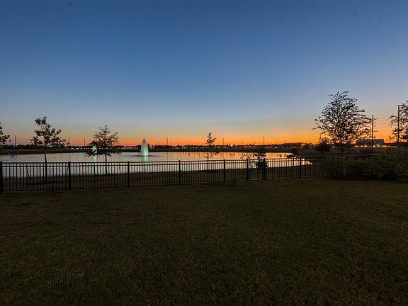 Beautifully situated on the lake the sunsets are breathtaking!There's a large gorgeous bubbling fountain just behind the home that adds greatly to the ambiance of the backyard setting.