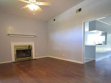 Very functional Family room with gleaming hardwood floors, working Fireplace and spacious Openness
