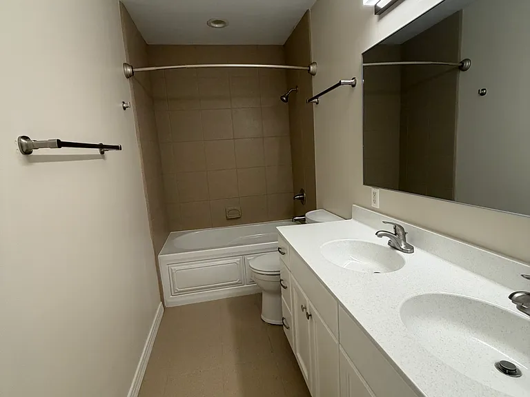 New Bathroom Finishes- Bathroom with Tub and Double Vanity Sinks