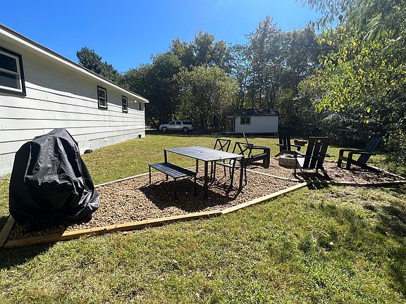 Back yard picnic table and patio and BBQ