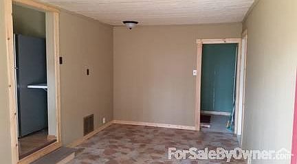 family room : new flooring and ceiling, access to Laundry room and garage
