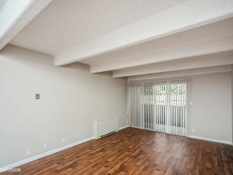 Spacious living room with private patio/balcony access