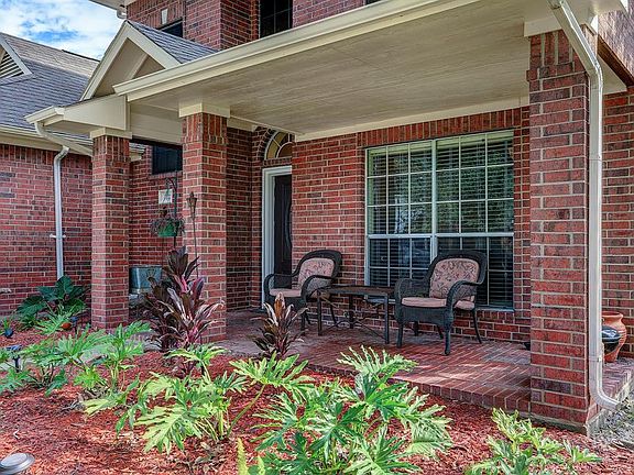 The sizable front porch offers plenty of room for sitting and watching the sunset.