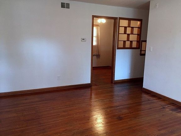 Living room with hardwood floors throughout the home.