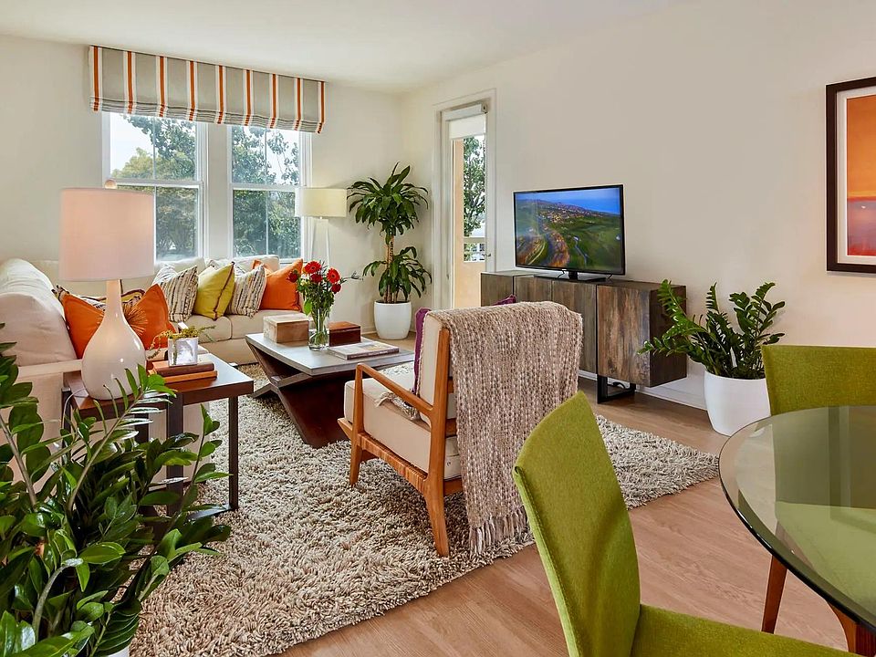 Living room gets ample daylight. Hardwood floors in the living room. Carpets in both bedrooms.