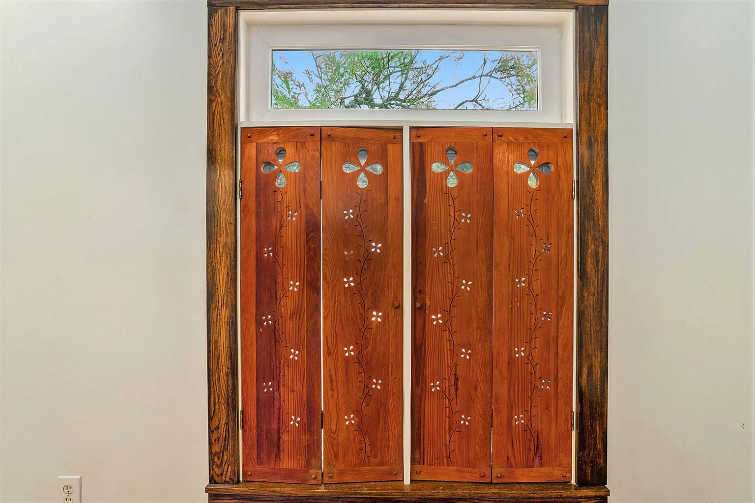 Flower cutouts in wood shutters