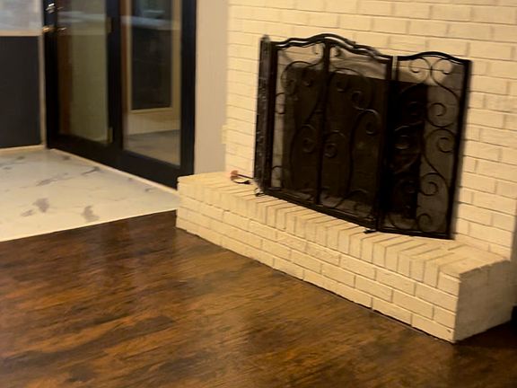 Den and doors to Sunroom