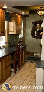 Office area with custom cabinets and entry