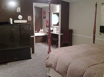 looking to the master bath through the master bed