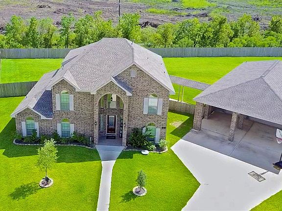 Beautiful Home Offering a Wonderful .5 acre & 6 Car Garage Tandem w/1/2 Bath