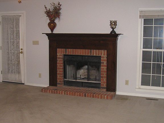 den w/wood burning fireplace