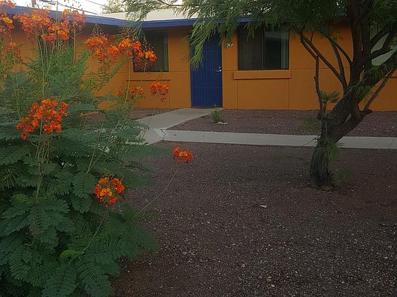 The front door. View of the courtyard, as this is a corner unit. The parking area is to the right.