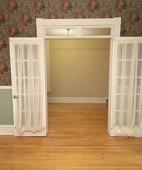 Looking from the dining room into the main floor bedroom/office