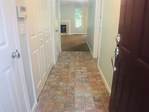 entry with 2 storage closets