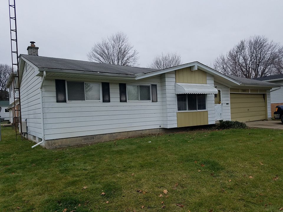 Corner house fenced backyard