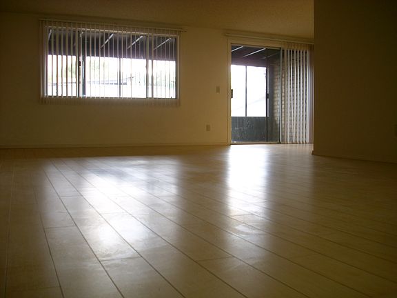 Living room opens into enclosed Arizona room
