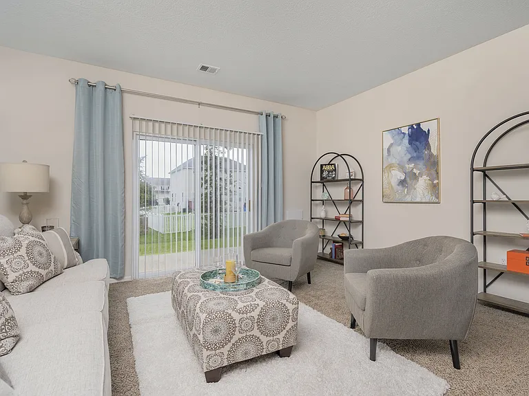 Relax and unwind in a beautifully designed living space with cozy seating and chic accents.