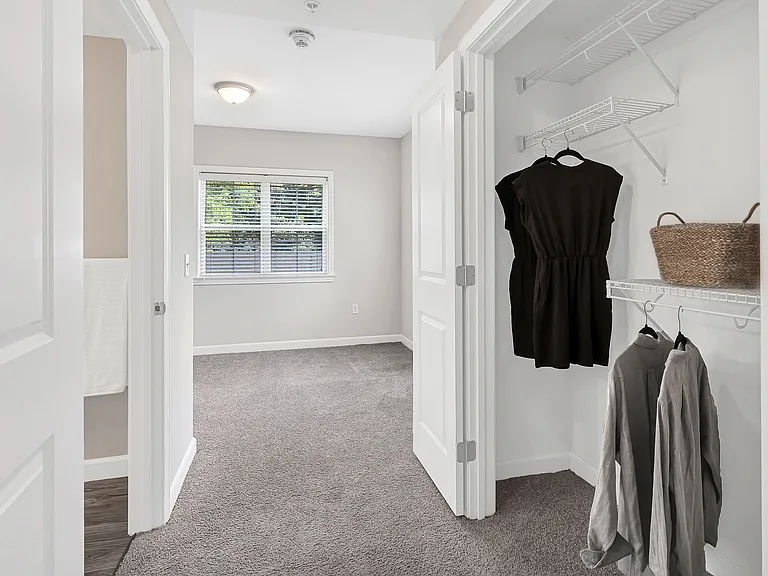 Step into the ultimate closet experience with double doors and wire shelving organizers in our 4 bed 4 bath floor plan. Your dream storage to hold all your style awaits!