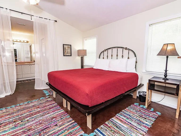 Boho-themed master bedroom suite. Firm but comfortable King bed.
