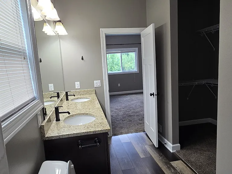 Master bath facing master bedroom. Large walk in closet on right.