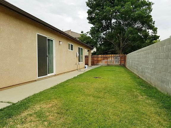 Backyard with concrete fence