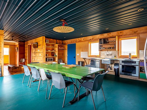 Huge Dining Room with blue front door at rear