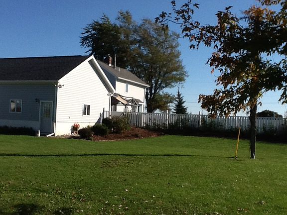 Great green yard with landscaped pool area