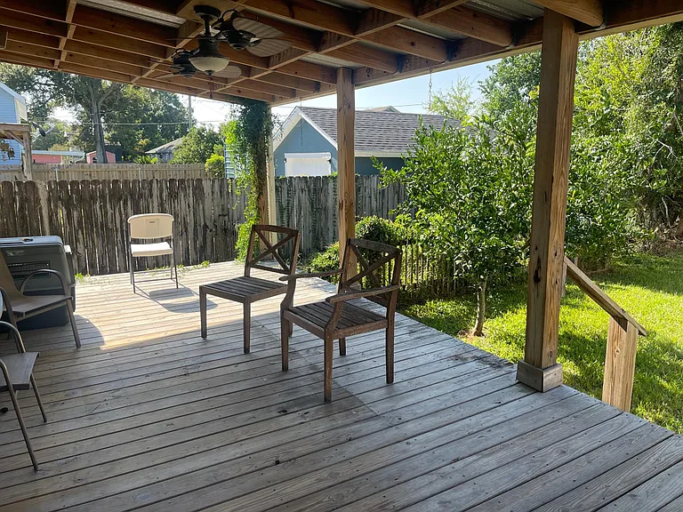 Outdoor covered patio with fans.