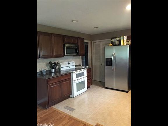The Kitchen and dining area opens to a wonderful wooded view from your private decking