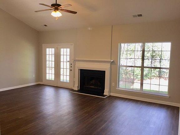 Large Living Area with vaulted ceiling and gas fireplace.