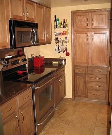 WOW!  Gorgeous new cabinets, new granite counters & an awesome built-in pantry