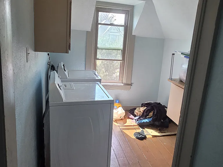 Laundry just outside entry door of unit
