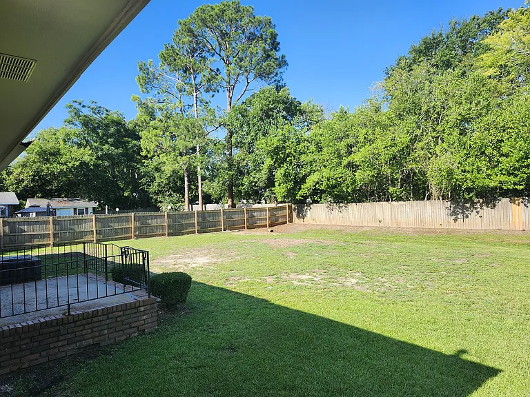 Backyard View showing a portion of the patio during Summertime. Spacious backyard!