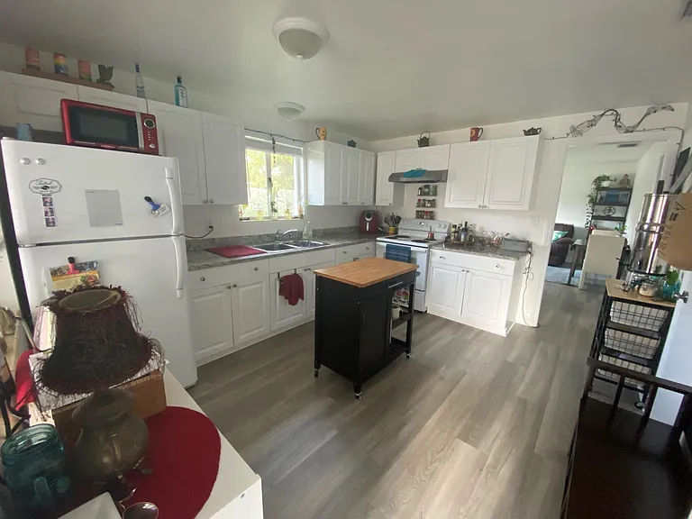Remodeled large kitchen with granite counters and new cabinets.