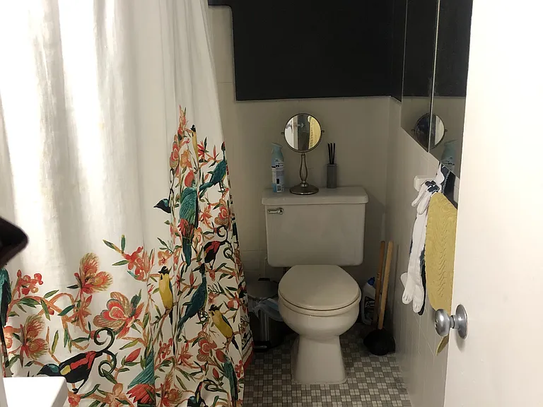 Clean bathroom including full size bathtub.