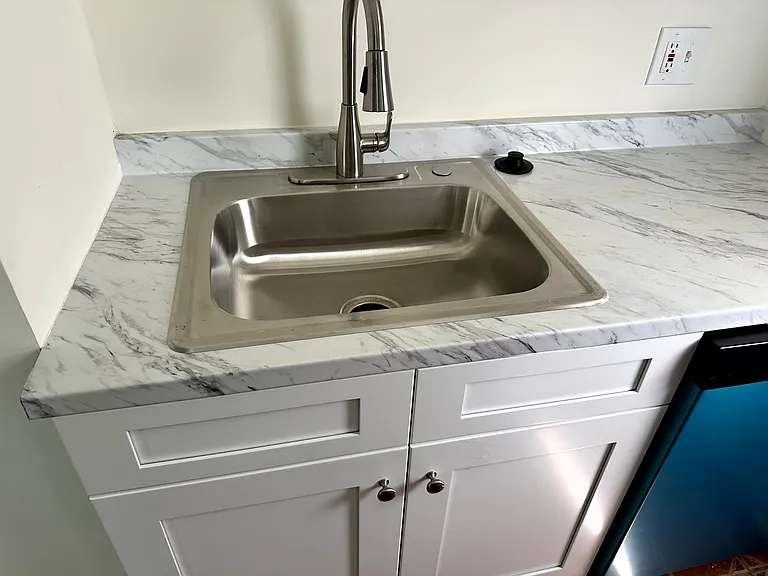 Updated kitchen counter tops and sink + dishwasher