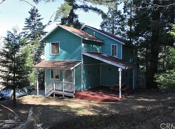 Back View of Home with Deck and Cover