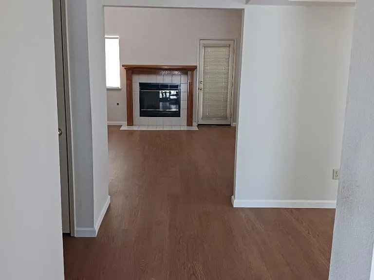Walkway to second living room area/fireplace.